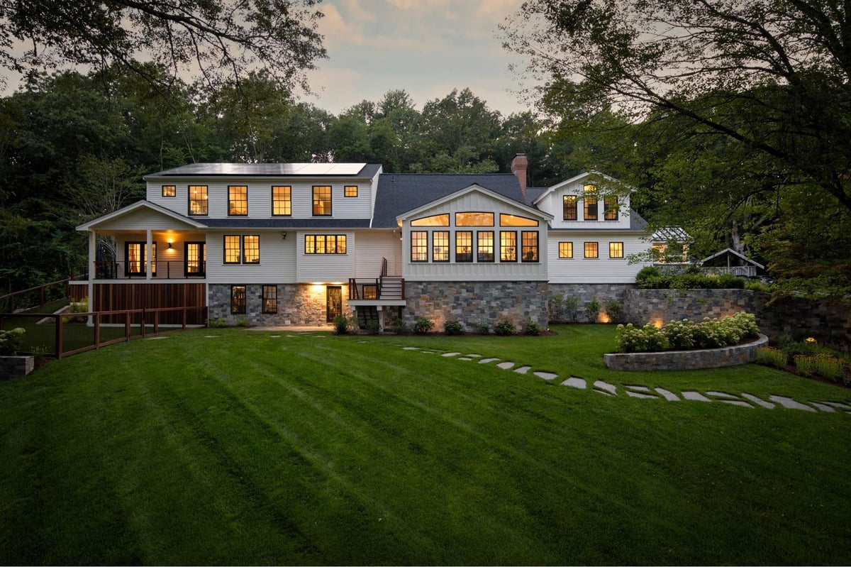 Black and white modern farmhouse renovation in acton, massachusetts with large backyard
