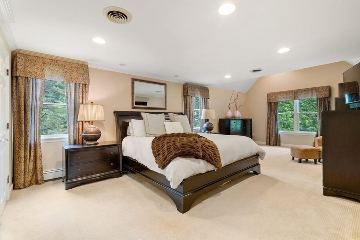 Master bedroom renovation with cozy decor and natural lighting by Thomas Buckborough & Associates in Acton, MA