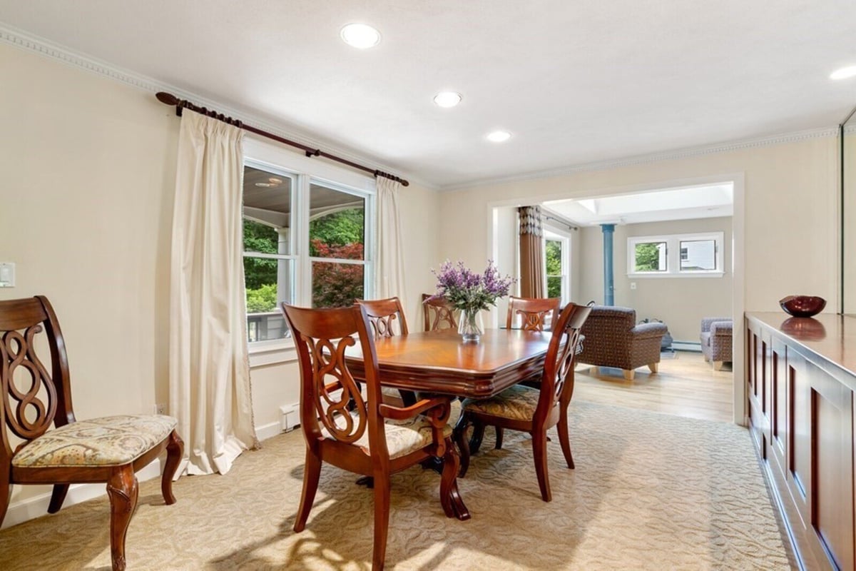 Remodeled dining area opening into bright living space, designed by Thomas Buckborough & Associates in Acton, MA