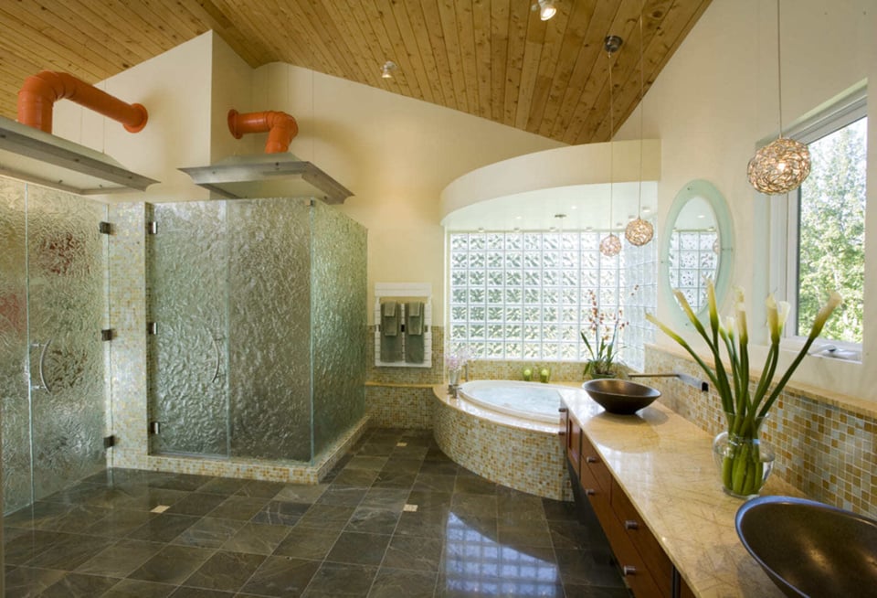 Luxury bathroom renovation with glass-enclosed showers, vessel sinks, and a soaking tub, designed by Thomas Buckborough & Associates in Acton, MA