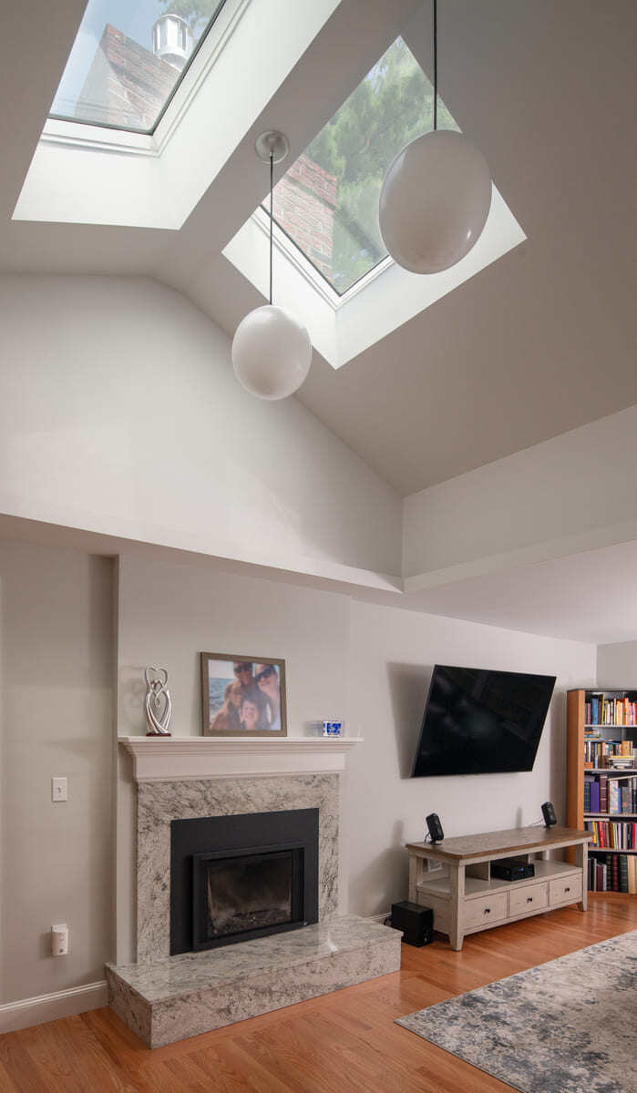 A kitchen remodel in Acton, MA, with custom cabinetry, a bright open layout, and a dining area seamlessly connected to the kitchen
