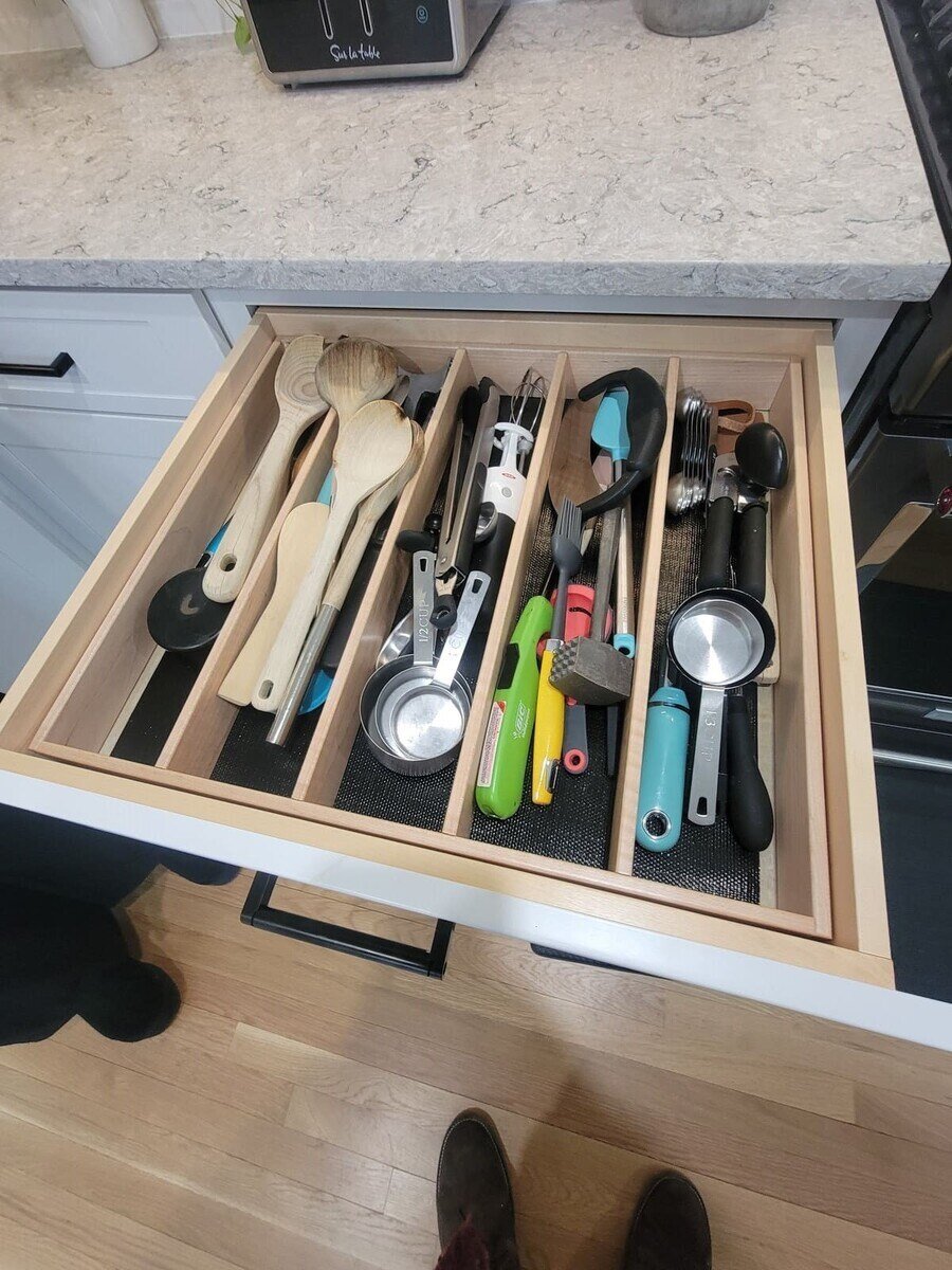 Custom utensil drawer with compartments for efficient kitchen organization in a Sasot Rendo Remodel