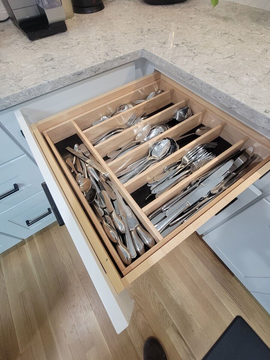 Modern kitchen drawer featuring neatly arranged cutlery and utensils for efficient storage in a Sasot Rendo Remodel