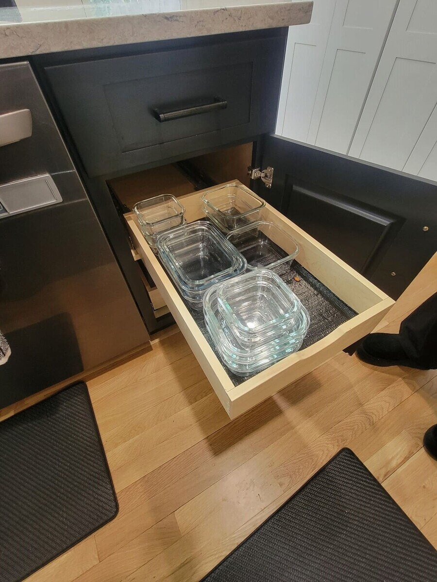 Smart kitchen storage with a dedicated drawer for glass containers, designed for accessibility and convenience in Acton, MA