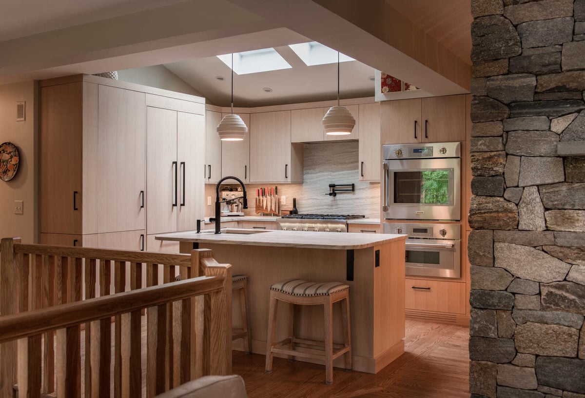 Modern kitchen remodel with light wood cabinetry and skylights in a Shea home by Thomas Buckborough & Associates in Acton, MA