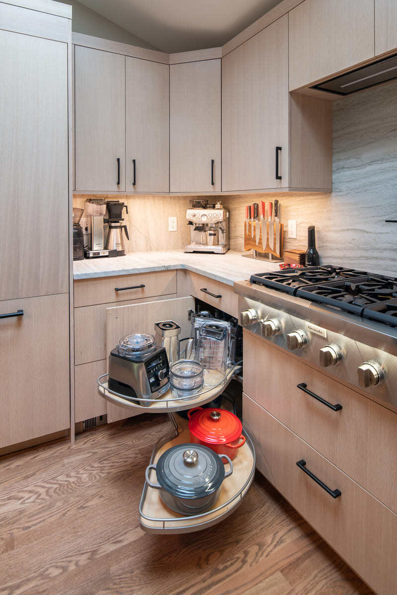 Smart kitchen organization with a rotating shelf system for easy access to appliances in Acton, MA
