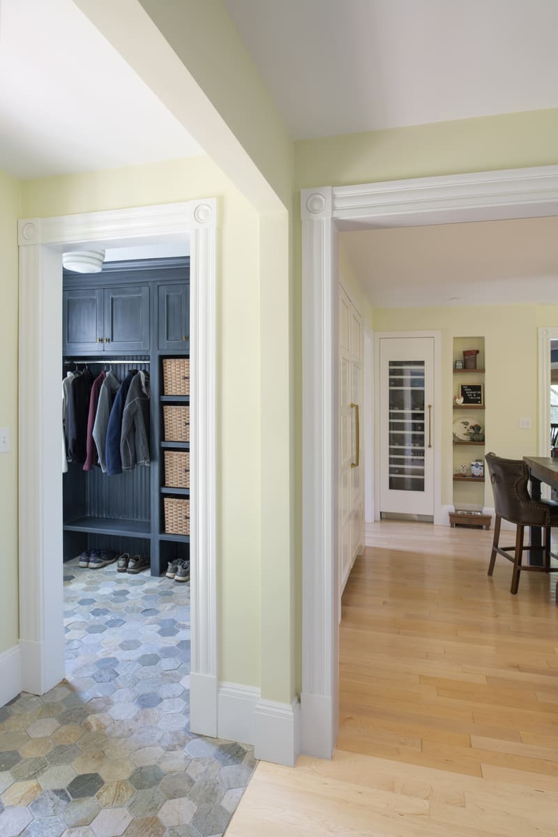 Functional and elegant entryway design with ample storage and custom-built cabinetry in a Tucker Remodel project by Thomas Buckborough & Associates