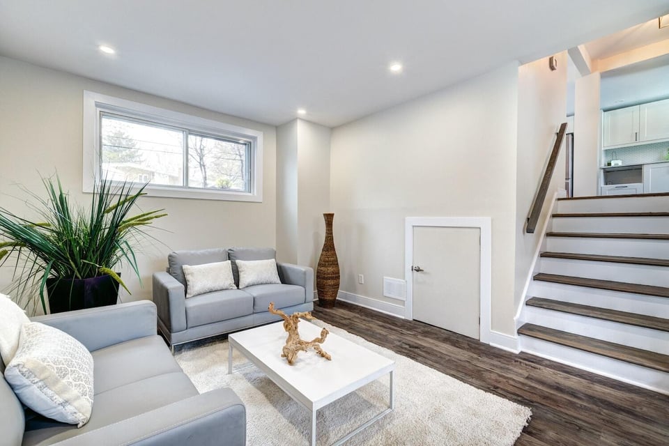 Stairs leading to a basement sitting area.