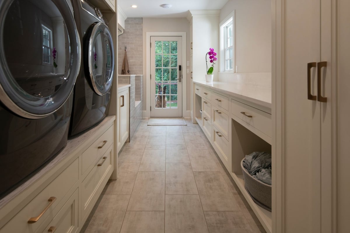 custom mudroom in acton, massachusetts with dog shower, laundry, and storage