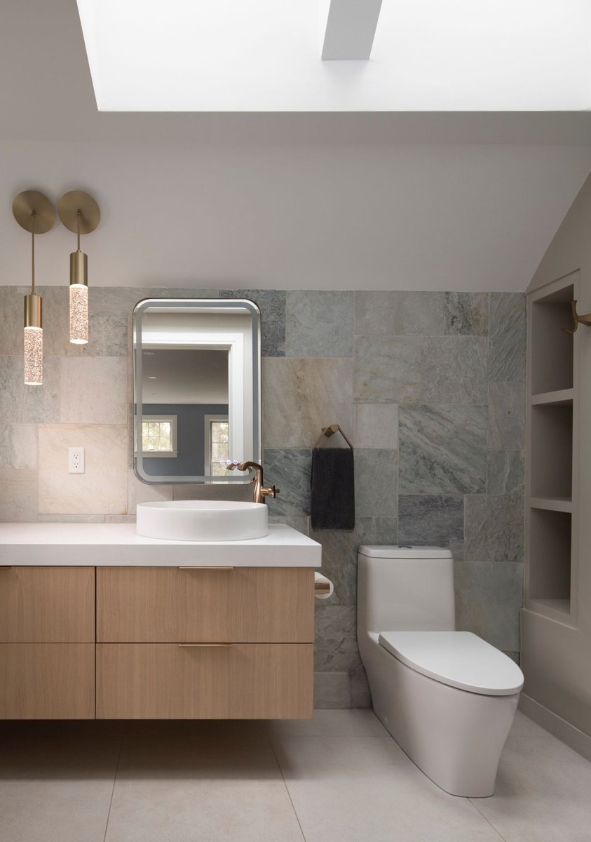 luxury bathroom renovation with earth tone tiles