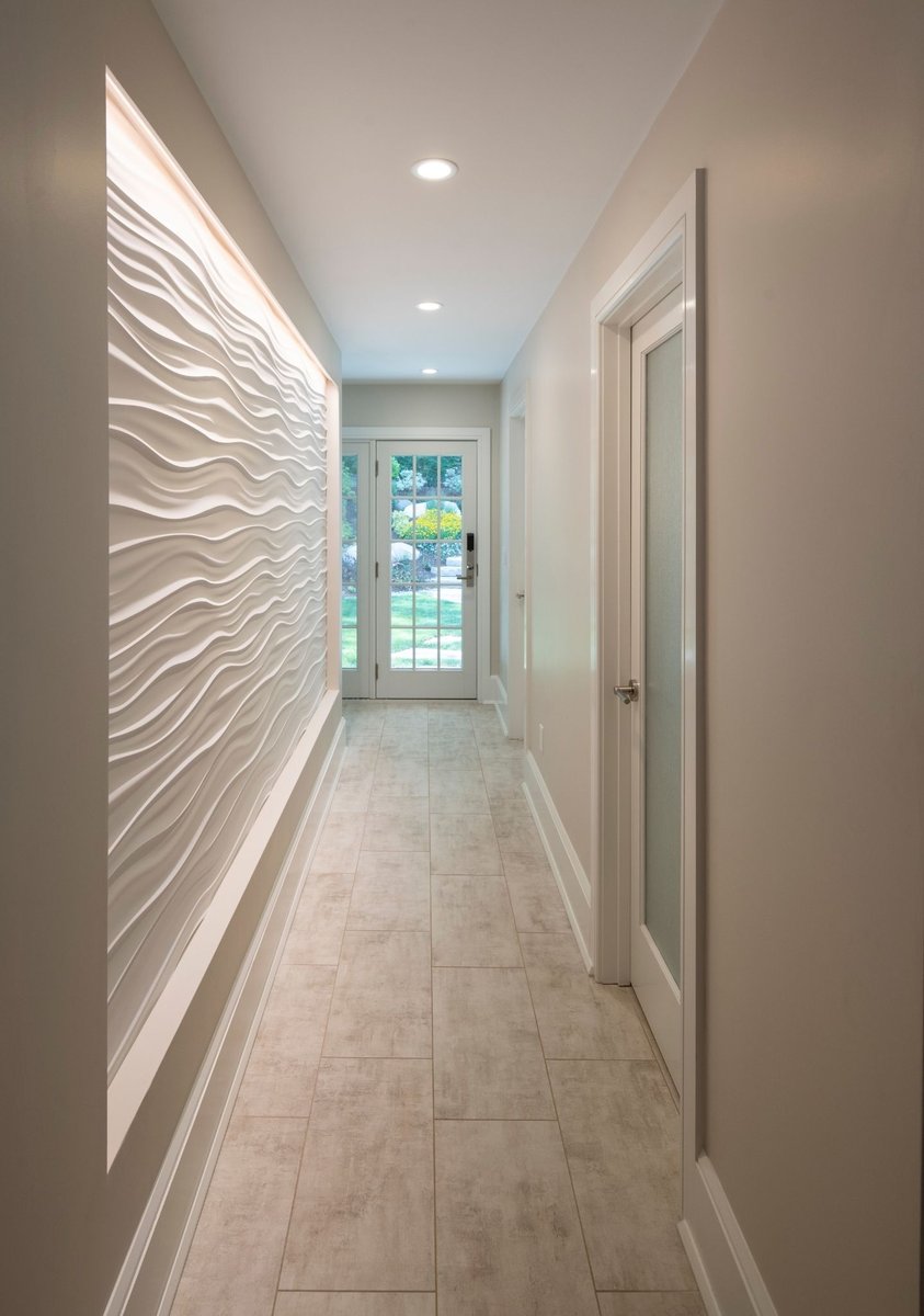textured accent wall in a hallway of an acton home remodel