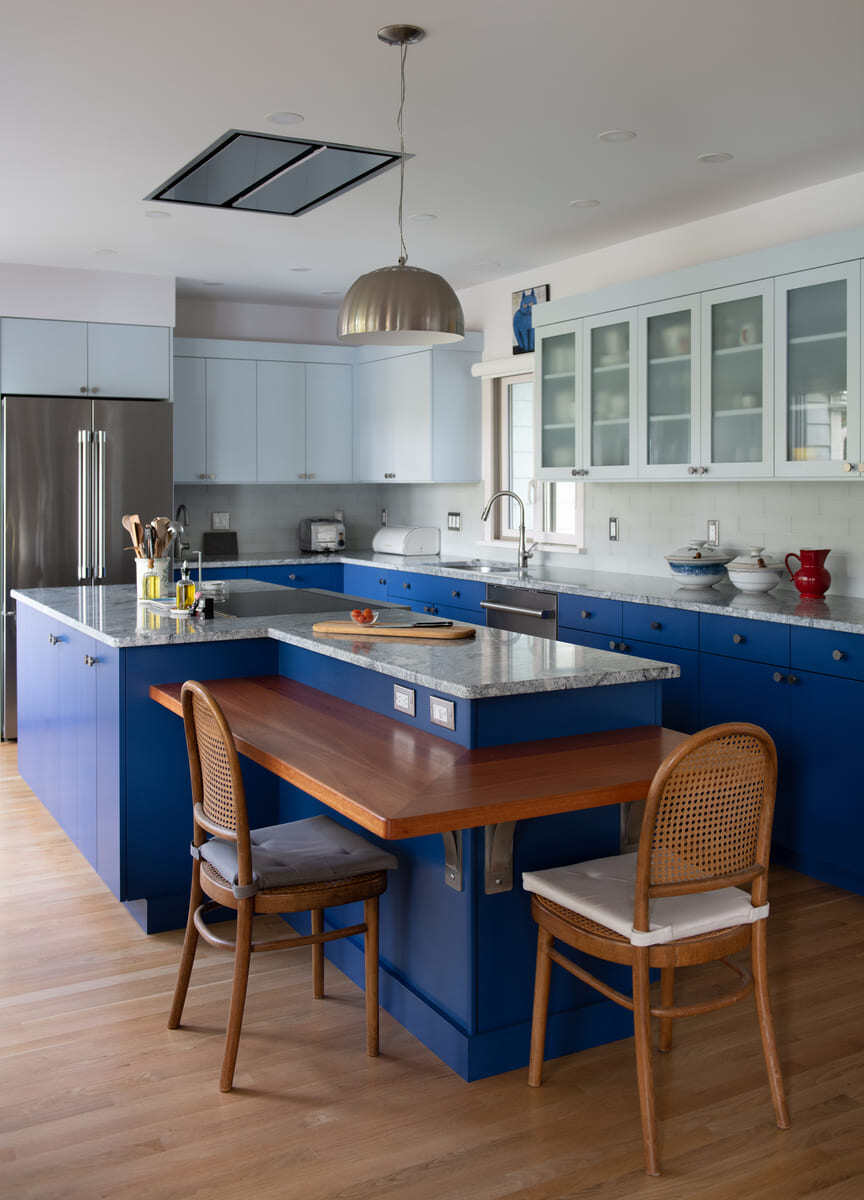Open-concept kitchen with a spacious island, elegant pendant lighting, and sleek stainless steel appliances
